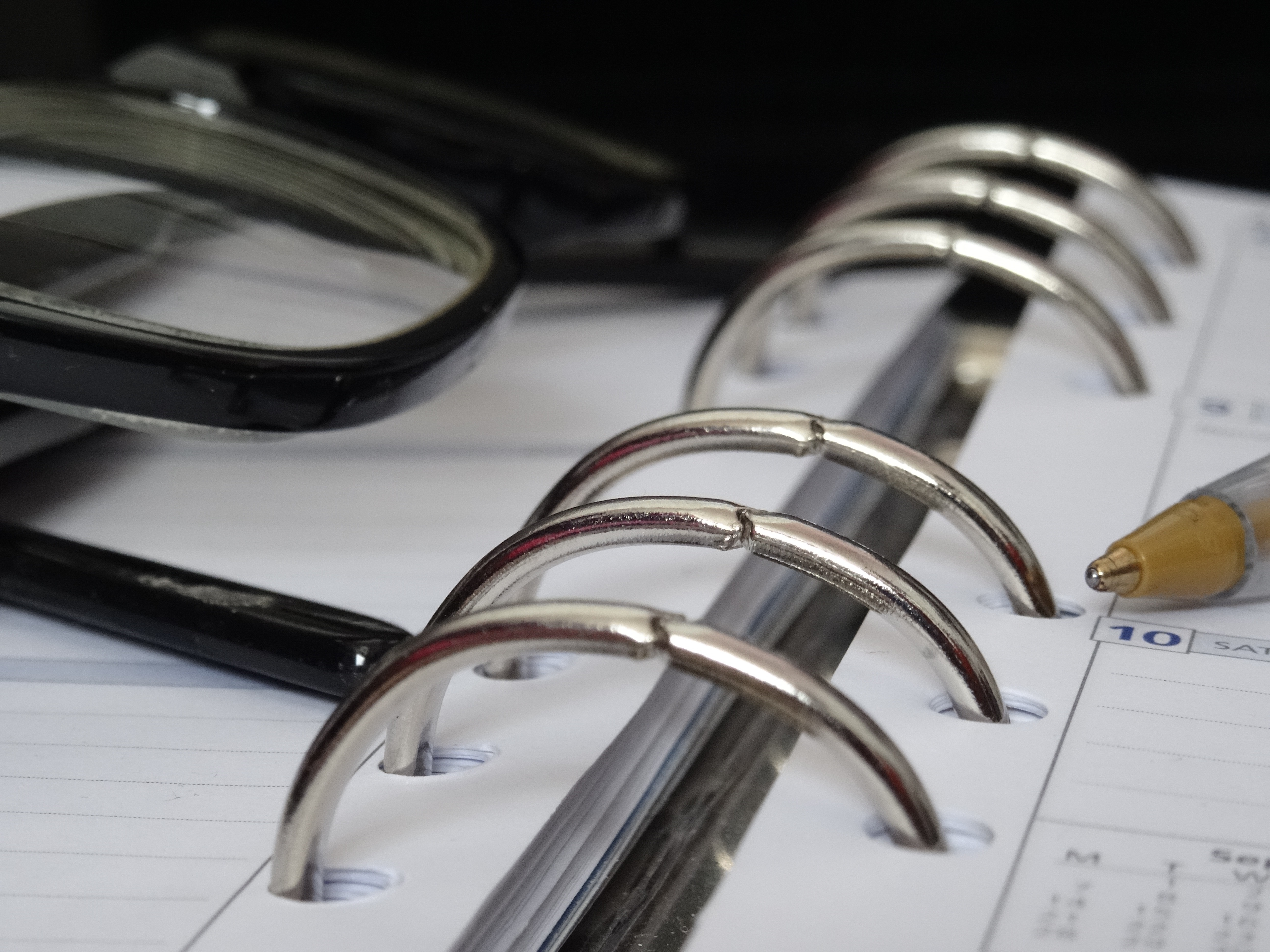 A planner and glasses.
