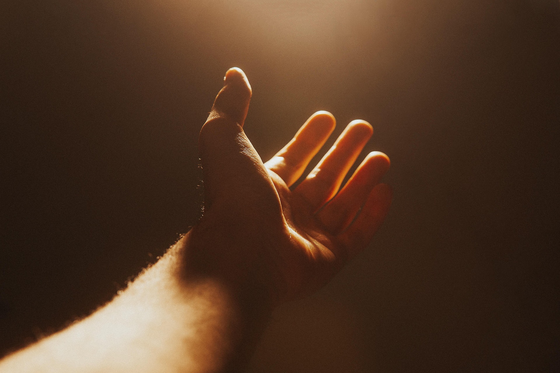 An outstretched hand asks for help